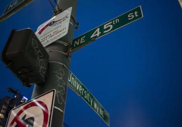 Street sign showing the intersection of The Ave (University Way) and 45th Street in U-District on Feb 14, 2024.