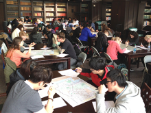 Students studying maps