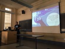 Geography Graduate Student Edgar Sandoval presenting a PowerPoint presentation.