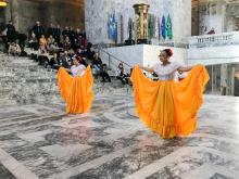 Two dancers performing in a government building.