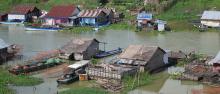 Houses built on a riverbank in Cambodia. 