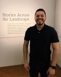 Sandoval in front of a museum exhibit