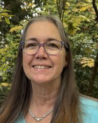 Head shot Suzanne Withers by tree