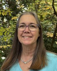 Head shot Suzanne Withers by tree