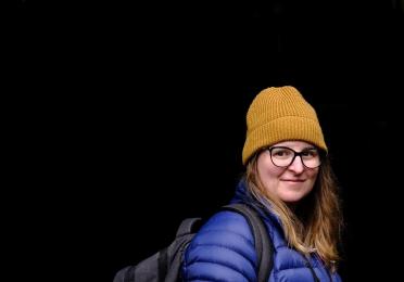 Person outside wearing a jacket and hat