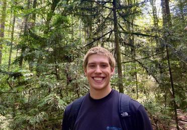 Portrait photo of Maro Denton in a forest