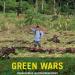 Green Wars book cover. A man raising a stick in front of a forest. 